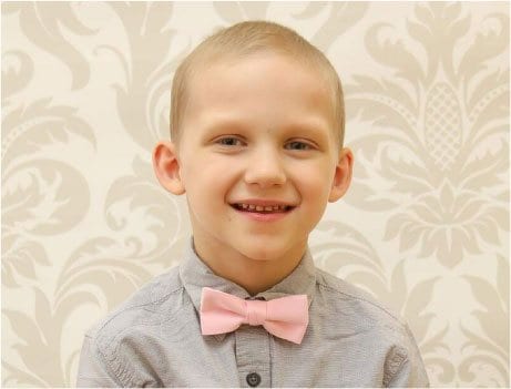 Image of Smiling Boy Wearing a Pink Bowtie